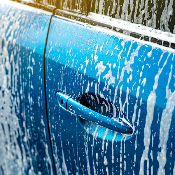 car getting washed with soap and foam